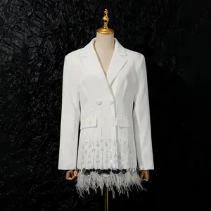 Detailed view of white blazer with elegant ostrich feathers and sequin shell trim.