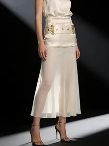 Elegant champagne sheer mesh midi skirt with silk-like overlay and gold hardware