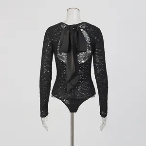 Close-up back view of a sexy black lace long sleeve bodysuit with a large bow detail
