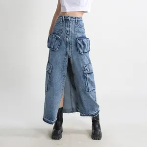 Detail of high-waisted denim cargo maxi skirt with multi-pockets and raw hem