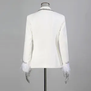 Back view of white french blazer with rhinestone collar and feather cuffs detail