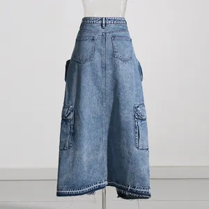 Back view of a long denim skirt featuring cargo pockets and a raw hem.