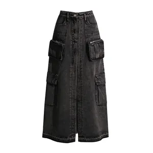 Close-up view of a washed charcoal denim skirt highlighting its four utility cargo pockets