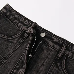 Close-up detail of high-waist black washed denim skirt with zipper and button