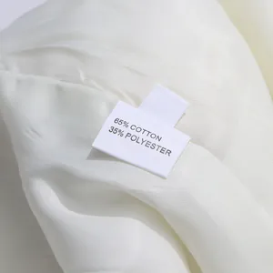 Detail shot of the fabric label showing 65% cotton and 35% polyester composition