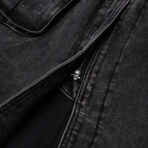 Close-up detail of high-quality silver metal zipper on washed black denim skirt fabric