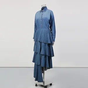 Vintage denim two-piece set featuring a long-sleeve shirt and tiered maxi skirt on mannequin.