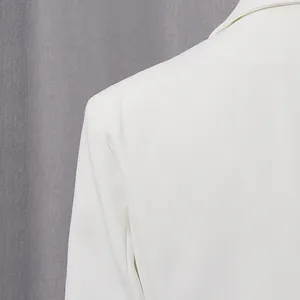 Close-up detail showing the refined shoulder and collar seam of this white blazer jacket