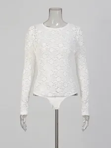 Elegant white floral lace long sleeve bodysuit for women presented on a clear mannequin