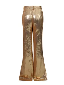 Back view of premium gold sequin wide-leg trousers from an elegant commuter suit set