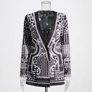 Detailed macro view of the palace-style printed blazer with intricate pearl bead embellishments
