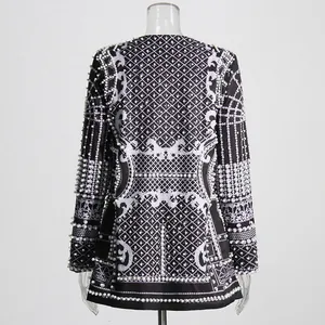 Rear view of luxury palace style blazer with heavy beadwork and pearl embellishments.