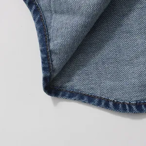 Close-up detail showing the fine stitching and denim texture of the vintage long skirt