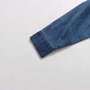 Close-up detail showing the high-quality stitching on the vintage blue denim sleeve cuff