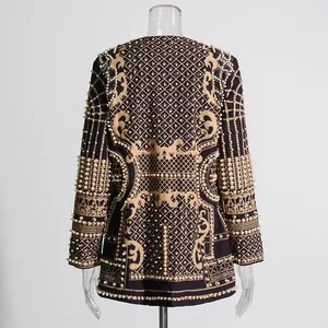 Back view detail of regal blazer with heavy gold embroidery and pearl bead embellishments