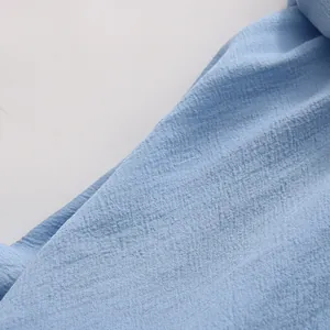 Detailed macro view of light blue breathable textured fabric for French style summer set