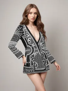 Elegant palace style black blazer featuring heavy pearl beadwork and a deep V-neck design