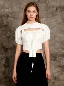 Detailed view of women's white puff sleeve shrug and drawstring camisole set