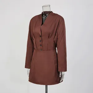 Front view of an elegant brown two-piece blazer and mini skirt set on a mannequin