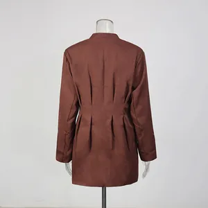 Detailed back view of an elegant brown waist-cinching blazer with stylish pleated accents