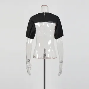Rear view of a black puff sleeve bolero shrug showing back zipper detail on a mannequin.