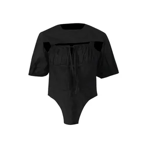 Detailed view of women's black puff sleeve shrug and camisole bodysuit two-piece set