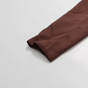 Detail of smooth brown fabric hem on elegant American style tailored suit set
