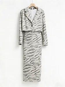 Detailed macro view of the zebra print sequins on the cropped jacket and skirt set