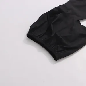 Close-up macro view showing elastic cuff detail on black puff sleeve blouse fabric