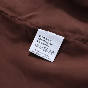 Close-up of garment care label showing 95% polyester and 5% elastane composition.