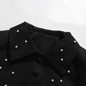 Close-up of elegant French vintage top with pearl embellishments and lace collar