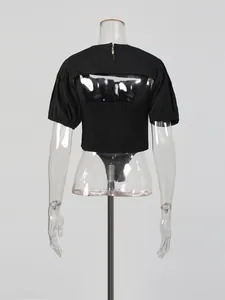 Back view of women's black two-piece set with puff sleeve shrug and cami bodysuit