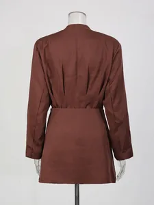 Elegant brown two-piece set featuring a fitted blazer and mini bodycon skirt, back view
