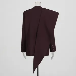 Back view of burgundy oversized blazer featuring a unique asymmetrical scarf collar detail