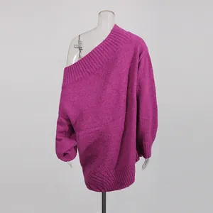 Rear view of a fuchsia off-the-shoulder oversized knit sweater on a clear mannequin.