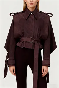 Detailed view of burgundy French style suede jacket with waist belt and lapel collar