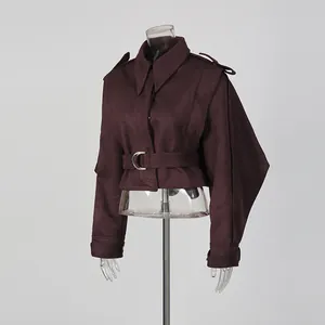 Side view of elegant burgundy lapel jacket with waist-cinching belt on mannequin