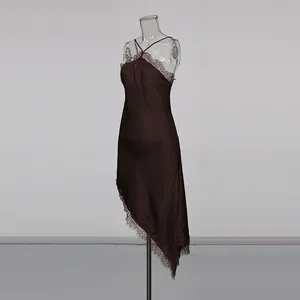 Close-up detail of dark brown satin halter dress featuring delicate lace trim