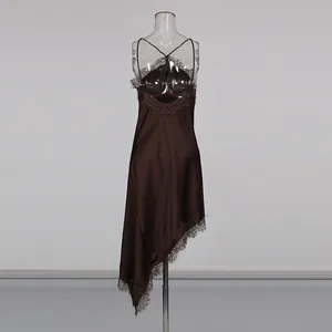Rear view detail of brown satin slip dress with delicate lace trim and asymmetrical hem