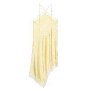 Close-up of yellow satin halter dress with delicate lace trim and asymmetrical hem.