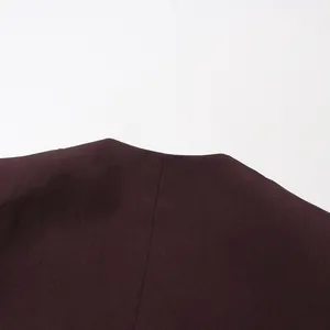 Detailed view showing the back neckline of a burgundy shawl single-button blazer coat