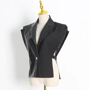 Detail view of a black motorcycle-style vest with PU leather panel and side cut-outs.