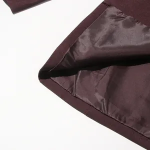Detail of burgundy blazer lining showing high-quality smooth satin fabric texture