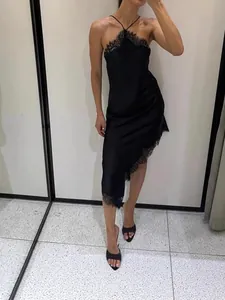 Elegant French style black halter lace dress with asymmetrical hem for a chic summer look