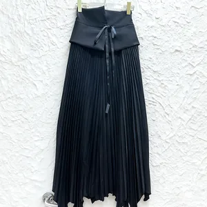 Detailed view of an elegant French style black high-waisted pleated skirt with drawstring