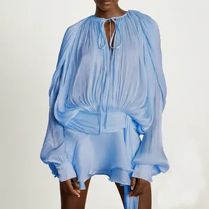 French style light blue pleated mini dress with ruffled hem and long billowy sleeves