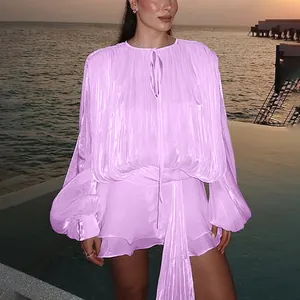 A detailed view showing the lavender pleated mini dress with elegant lantern sleeves