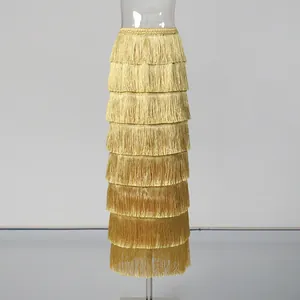 Elegant high-waisted gold tiered skirt featuring multi-layered vintage tassels