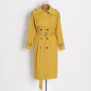 Elegant mustard yellow mid-length trench coat with double-breasted buttons and waist belt