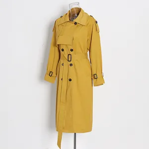 Display view of elegant mustard yellow British style mid-length trench coat on mannequin